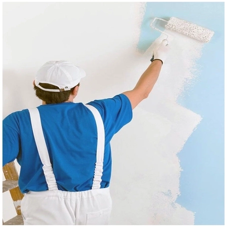 Painters adding finishing touch to office wall